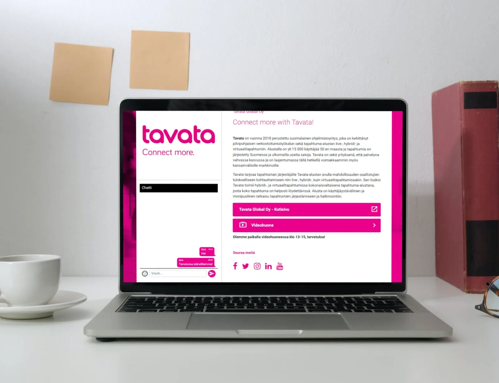 A laptop on a desk showing an exhibitor’s Tavata page with a chat panel